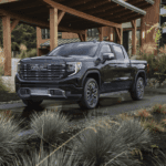 A stunning 2026 GMC Sierra 1500 Denali showcasing its bold redesign, parked in front of Linus Buick GMC in Vero Beach.