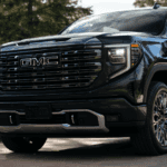 A new 2026 GMC Sierra 1500 AT4 pickup truck in the stunning Glacier White Tricoat, parked on a coastal road near Vero Beach, Florida.