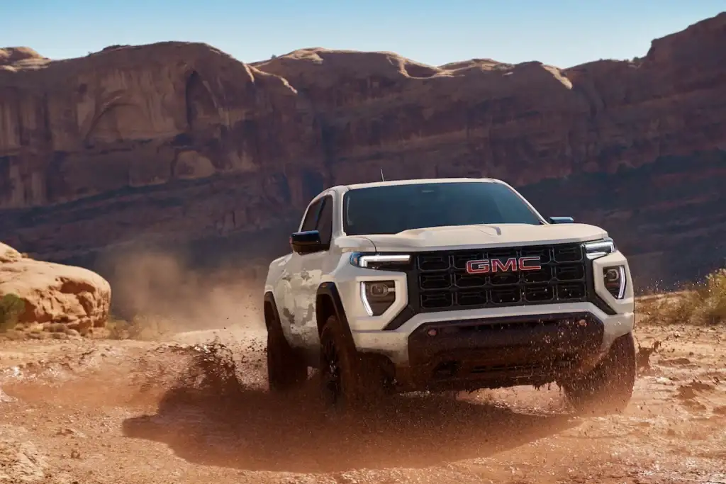 GMC Canyon vs Sierra at Linus Buick GMC — mid-size Canyon and full-size Sierra 1500 side by side in Vero Beach, FL
