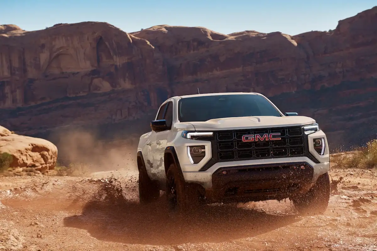 GMC Canyon vs Sierra at Linus Buick GMC — mid-size Canyon and full-size Sierra 1500 side by side in Vero Beach, FL