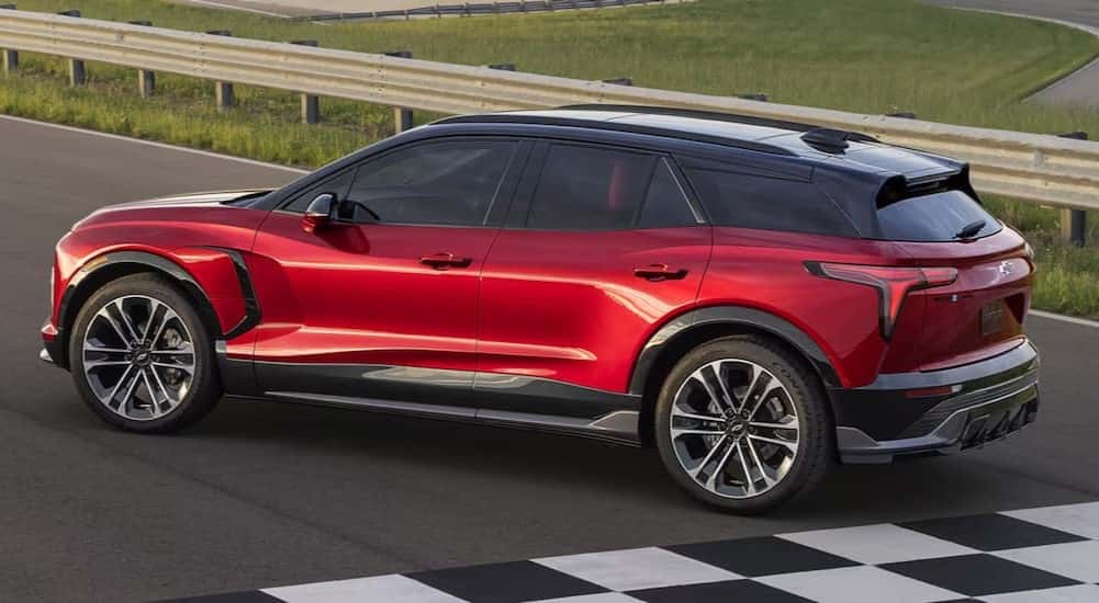 A red 2025 Chevy Blazer EV SS is shown parked near a finish line.
