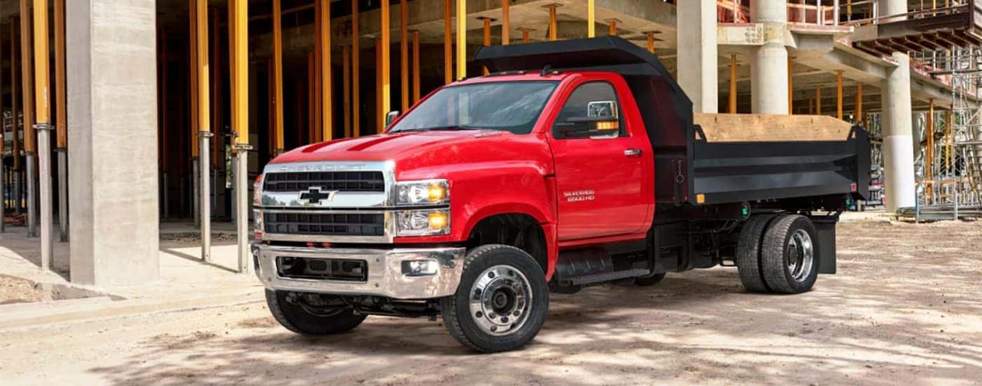 A red 2025 Chevy Silverado 6500 is shown from the side.