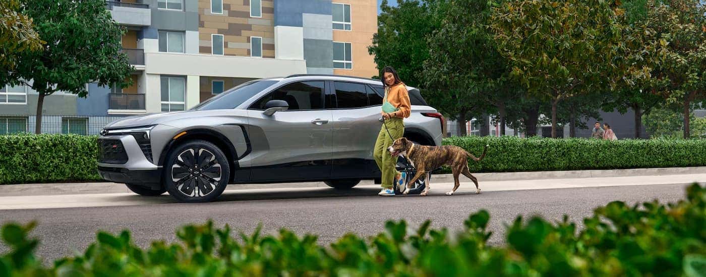 A grey 2025 Chevy Blazer EV RS parked on a side of a street.