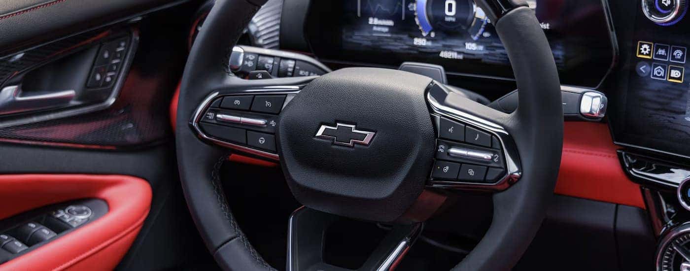 A close up of the steering wheel in a a 2025 Chevy Blazer EV RS for sale near Advance.