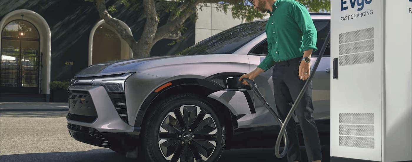 A grey 2025 Chevy Blazer EV RS is charging.
