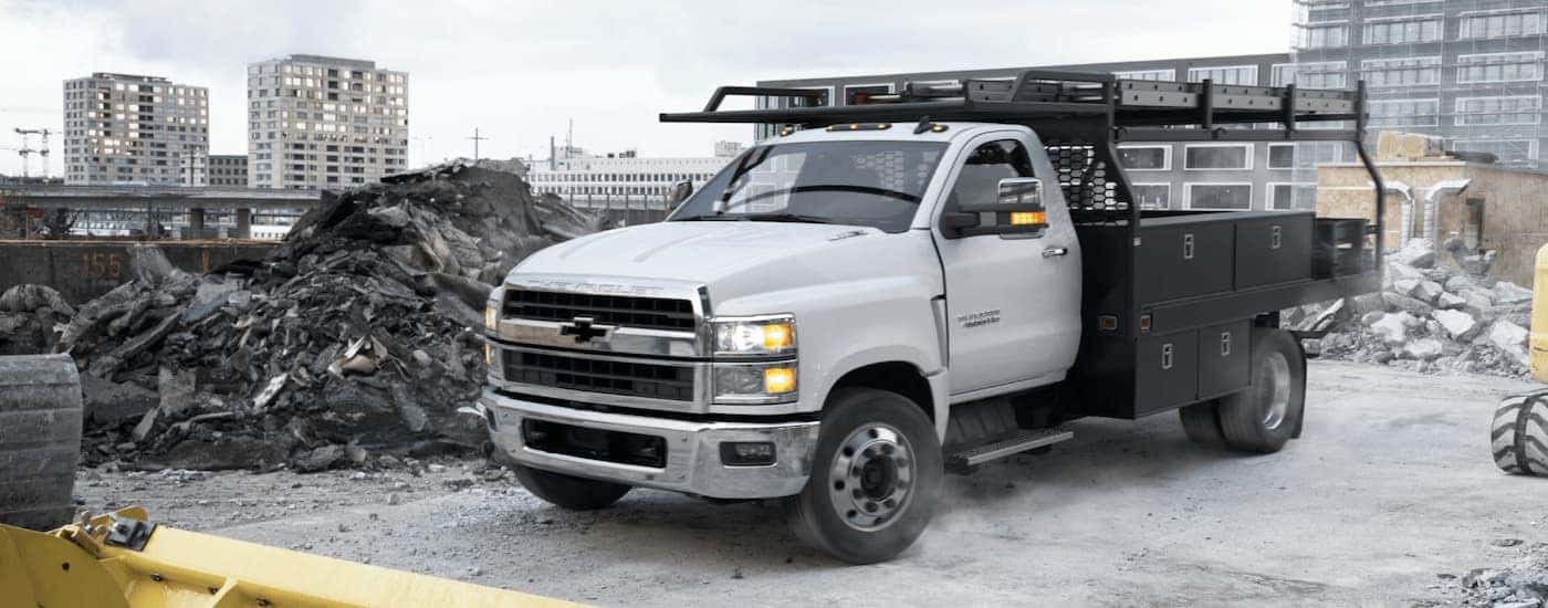 A white 2025 Chevy Silverado 5500 parked at a construction site.