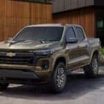 A green 2025 Chevy Colorado for sale parked on a driveway.