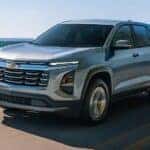 A silver 2026 Chevy Equinox LT driving on a highway.