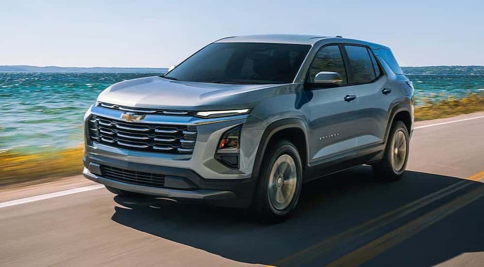 A silver 2026 Chevy Equinox LT driving on a highway.