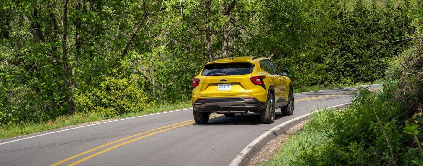 A yellow 2025 Chevy Trax from the rear.