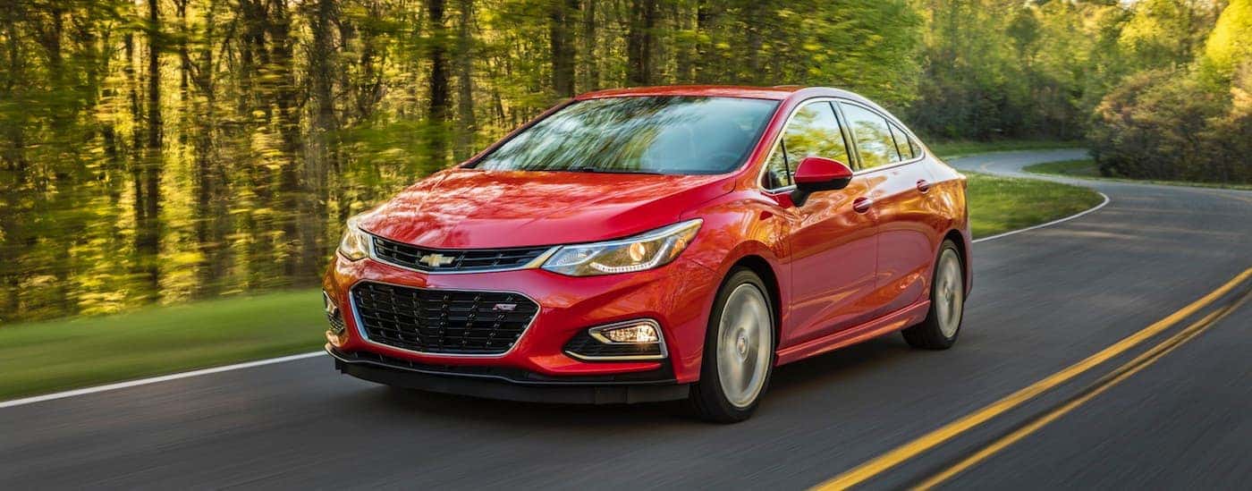 A red 2016 Chevy Cruze from the front at an angle.
