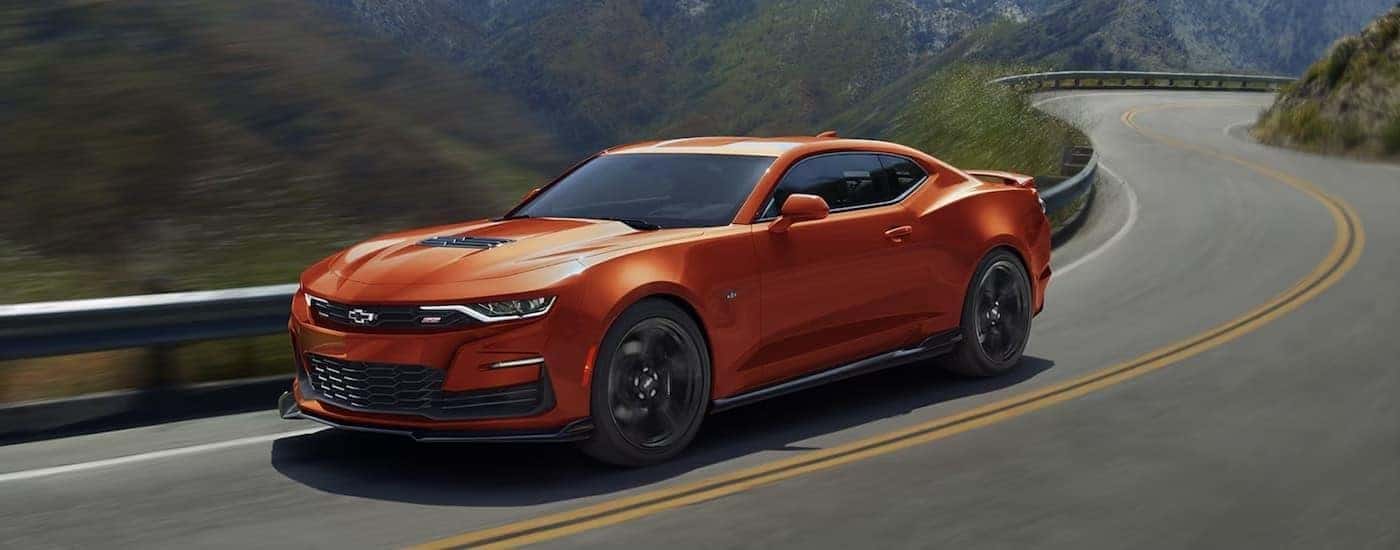 An orange 2022 Chevy Camaro from the side.