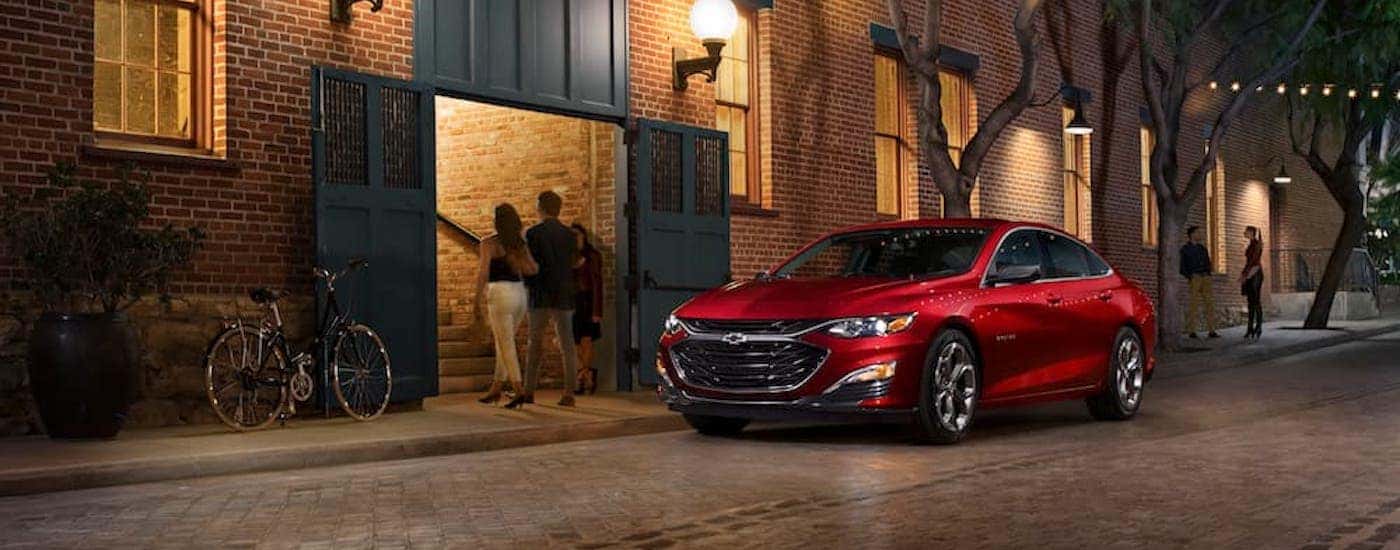 A red 2019 Chevy Malibu from the front after leaving a dealer that has a used Chevy for sale near Mocksville.