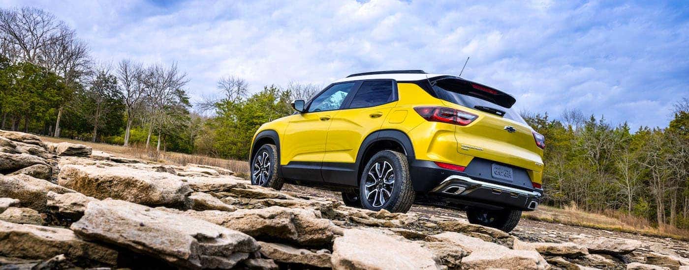 A yellow 2024 Chevy Trailblazer from the rear after leaving a dealer that has a used Chevy for sale near Oak Ridge.