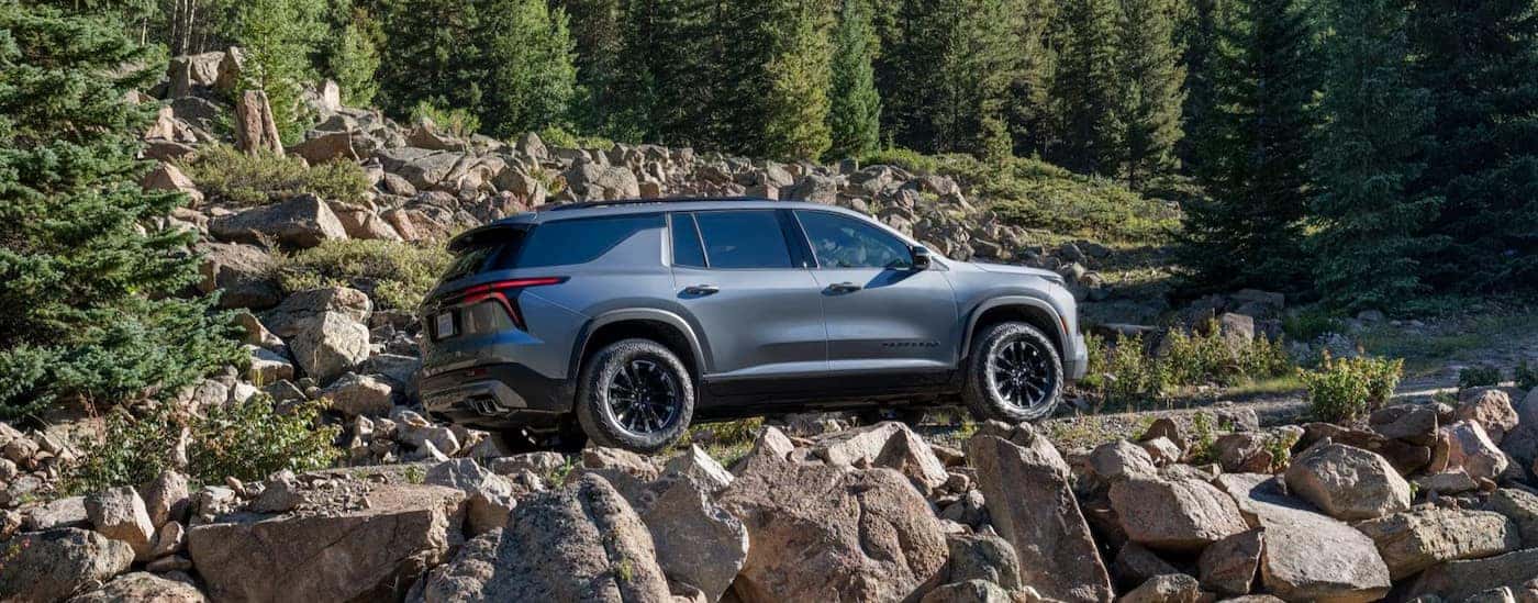 A silver 2025 Chevy Traverse off-roading.