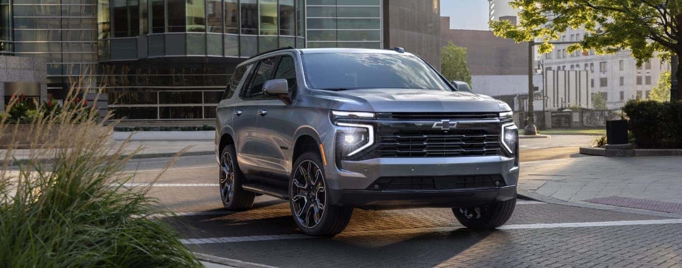 A silver 2025 Chevy Tahoe for sale Winston Salem from the front at angle.
