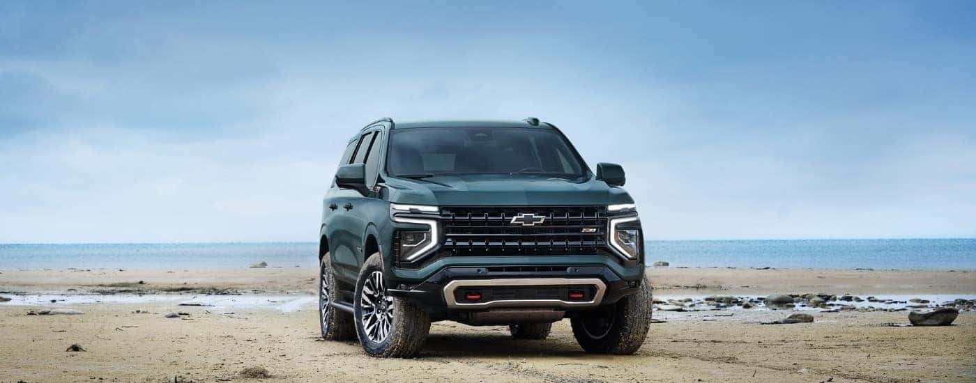 A green 2025 Chevy Tahoe from the front.