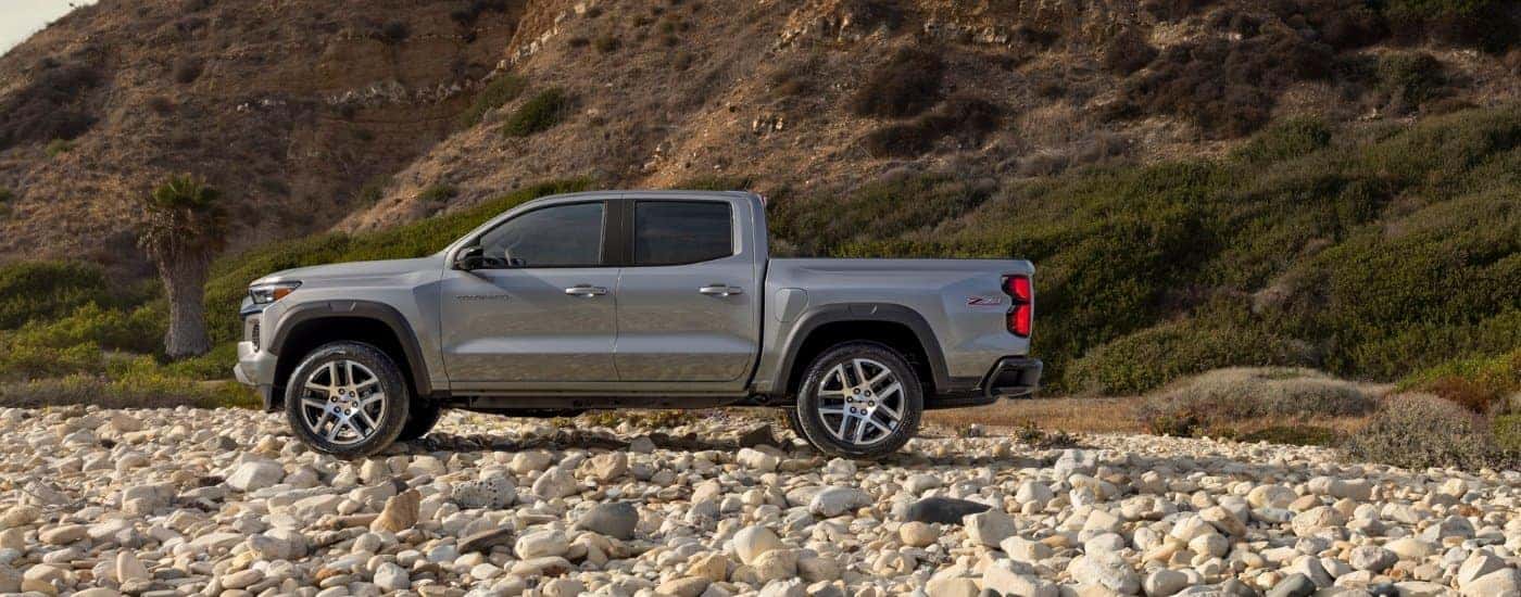 A silver 2025 Chevy Colorado for sale in Kernersville from the side.
