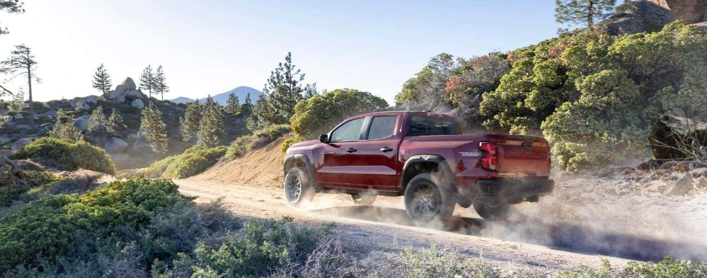 A red 2025 Chevy Colorado from the rear at an angle.