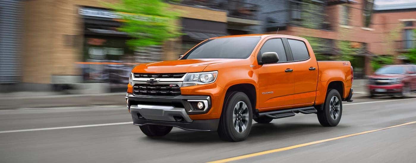 An orange 2021 Chevy Colorado for sale near me from the front at an angle.