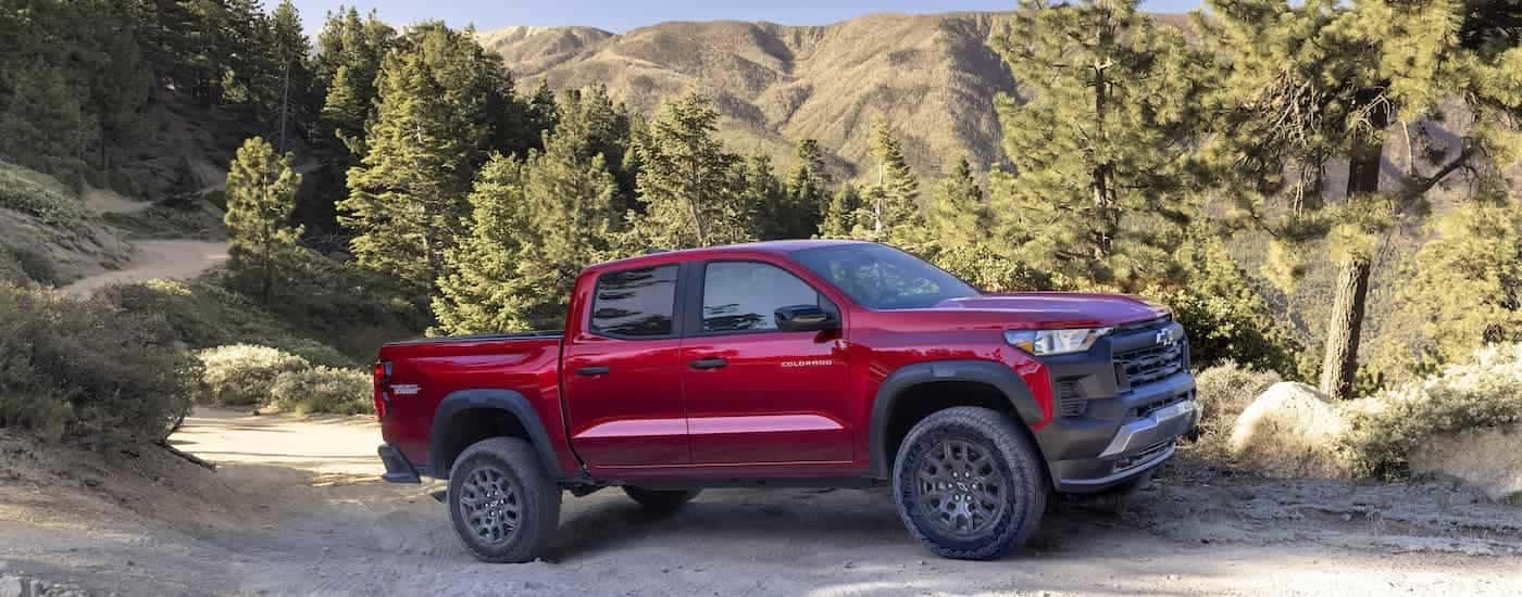 A red 2025 Chevy Colorado Trail Boss from the side.