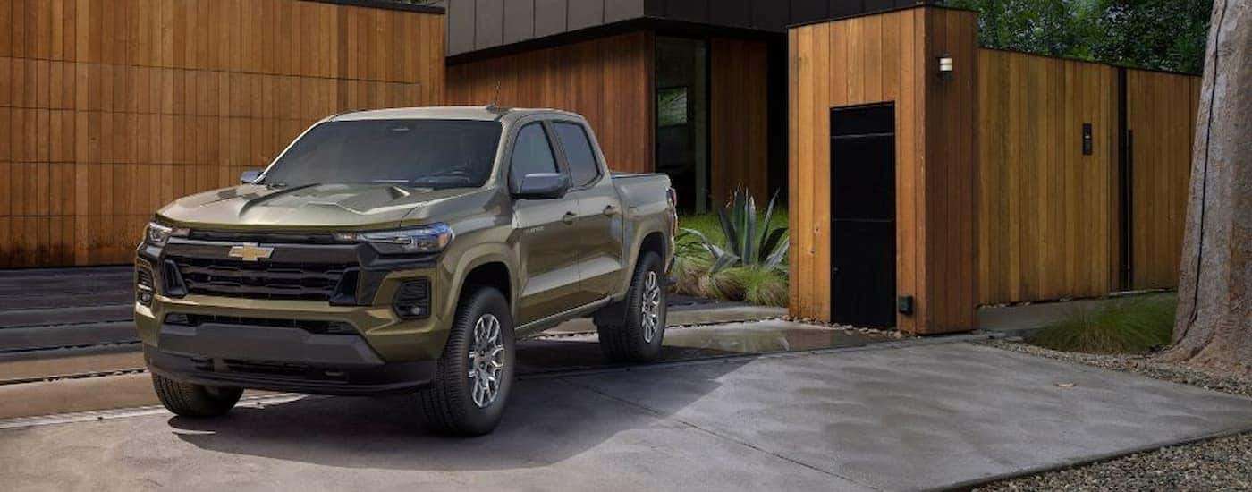 A green 2023 Chevy Colorado parked in a driveway