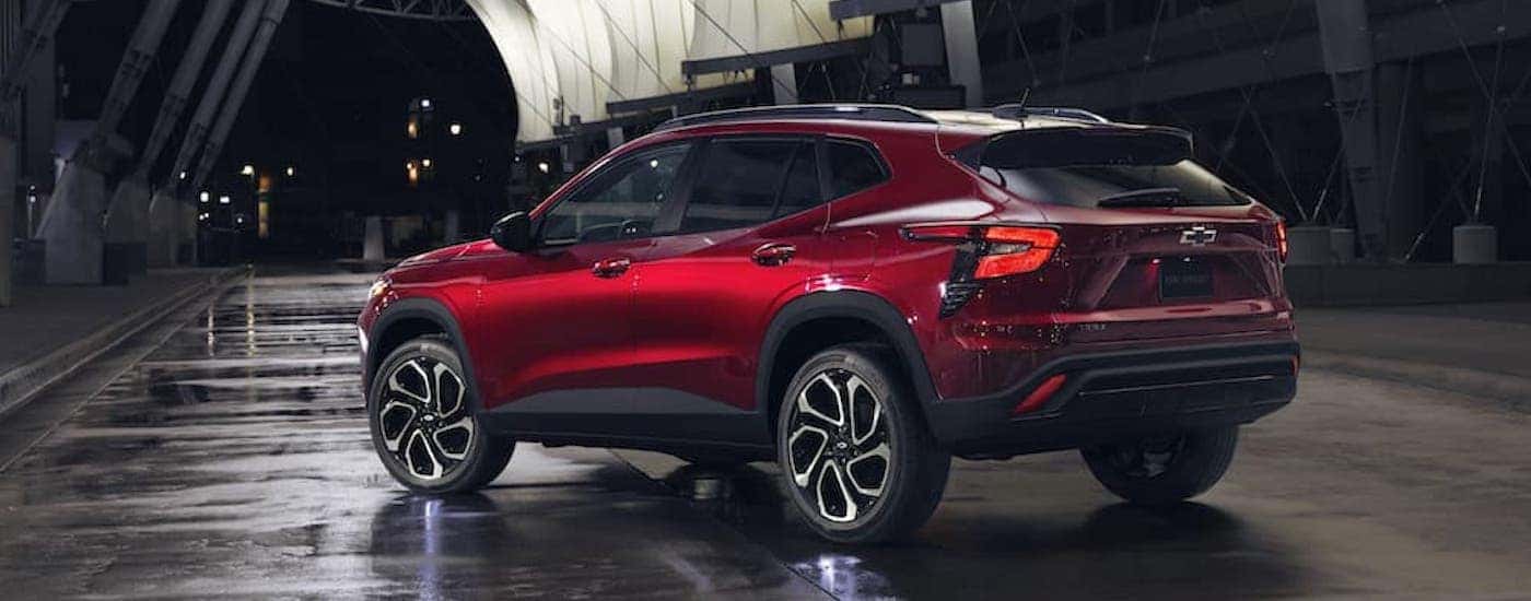 A red 2025 Chevy Trax from the rear at an angle.