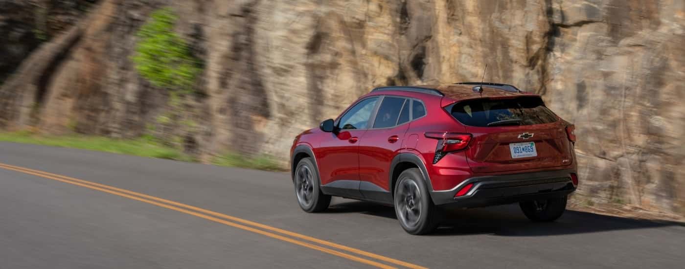 A red 2025 Chevy Trax for sale near Kernersville from the rear at an angle.