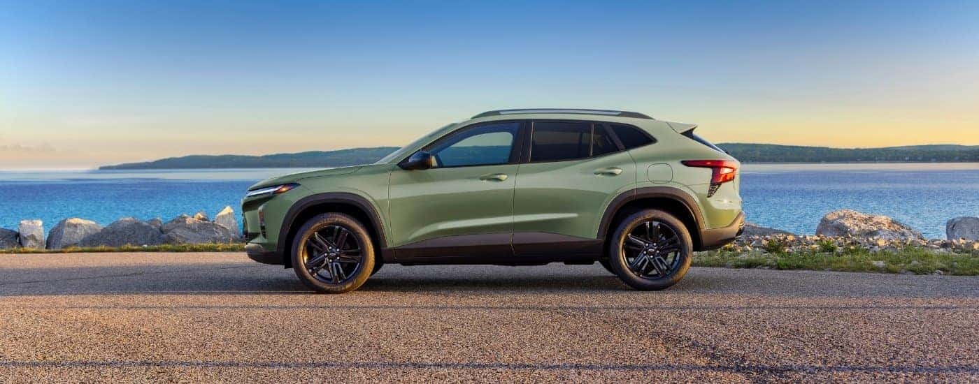A green 2025 Chevy Trax from the side.