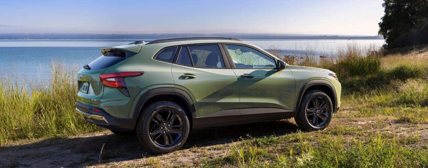 A green 2025 Chevy Trax for sale near me from the side.