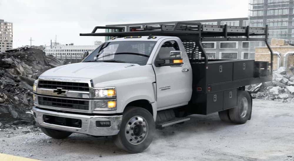 A white 2025 Chevy Silverado 4500 parked on a construction site.
