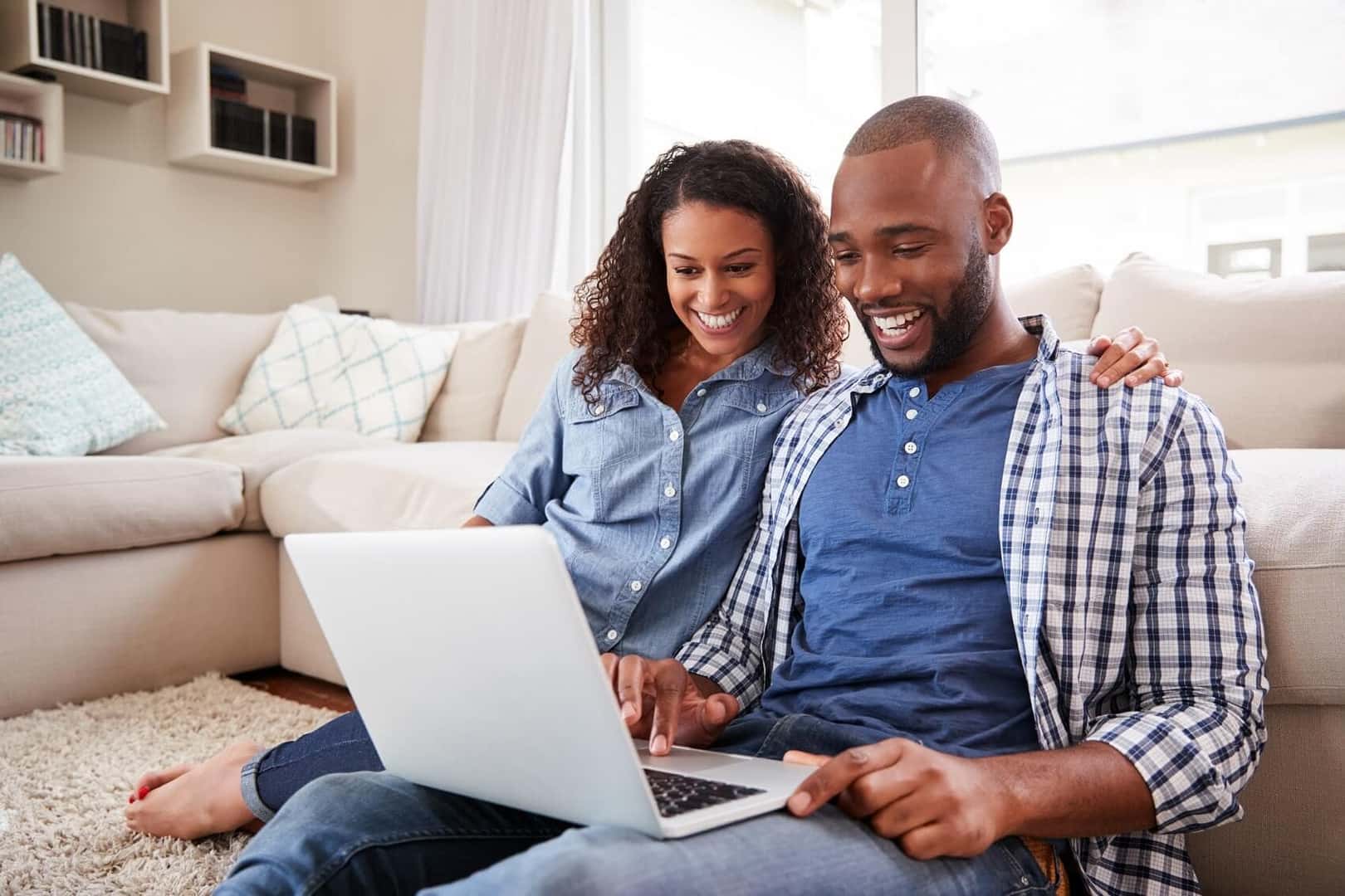 Couple browsing Pine Belt Mazda's inventory online
