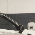 mechanic doing an oil change at Nissan