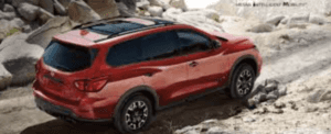 Nissan Pathfinder red against rocky backdrop
