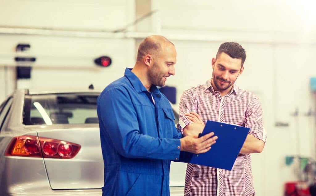 Technician explaining a Mazda recall
