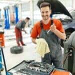 Mazda auto repair technician working on a car