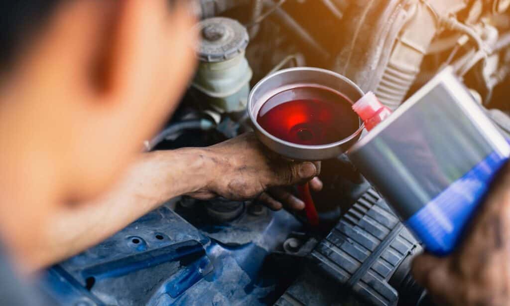Mazda service mechanic working on a transmission