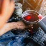 Mazda service mechanic working on a transmission