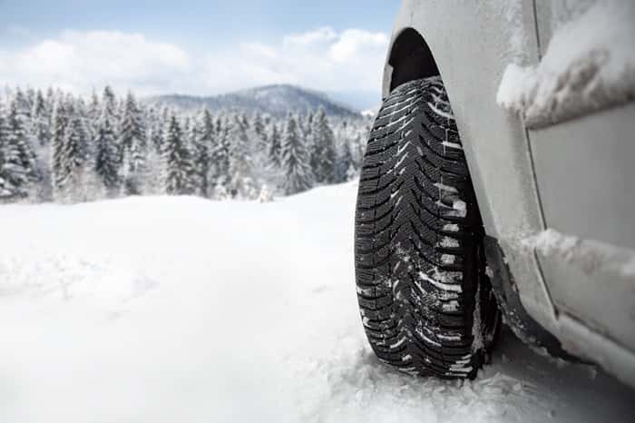 Car driving in the snow with Mazda service prep