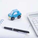 Calculating Mazda financing budget with a notepad