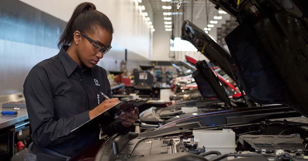 Technician working on a Mazda recall