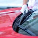 Mazda service technician replacing windshield wipers