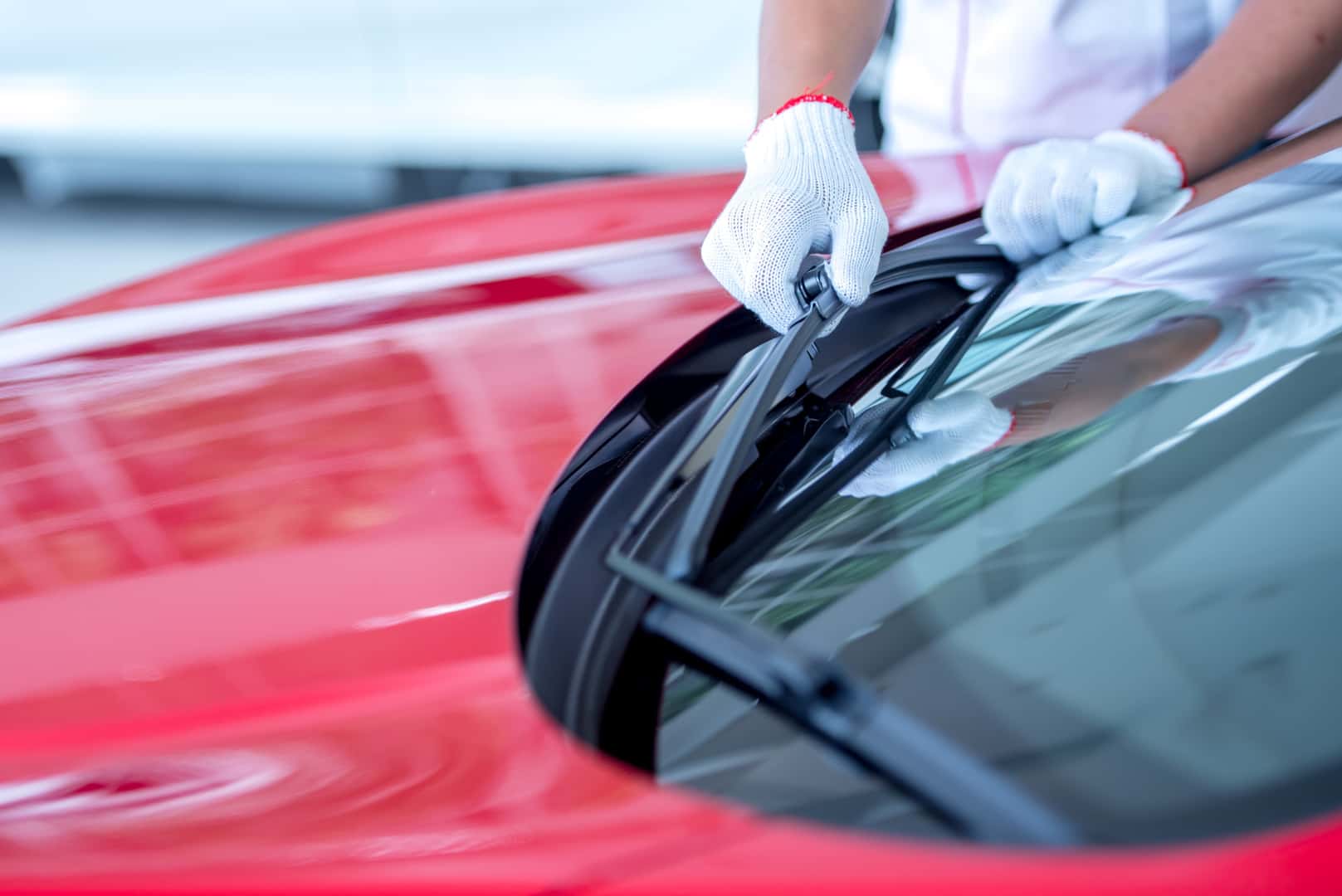 Mazda service technician replacing windshield wipers
