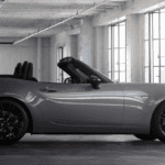 Man examining a Mazda lease vehicle