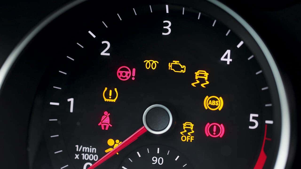 Dashboard of illuminated lights including the check engine light