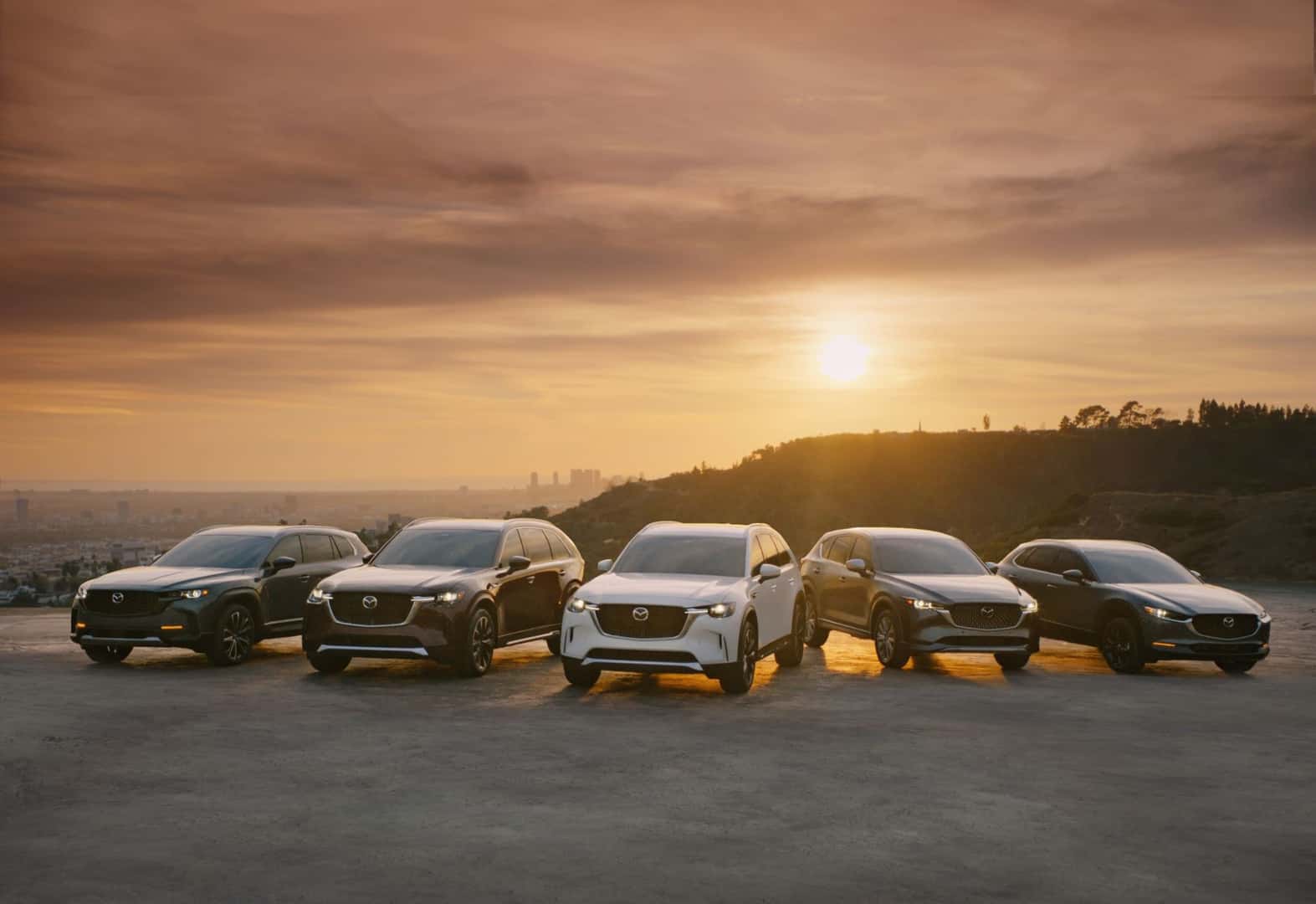 A lineup of vehicles equipped with Mazda safety features