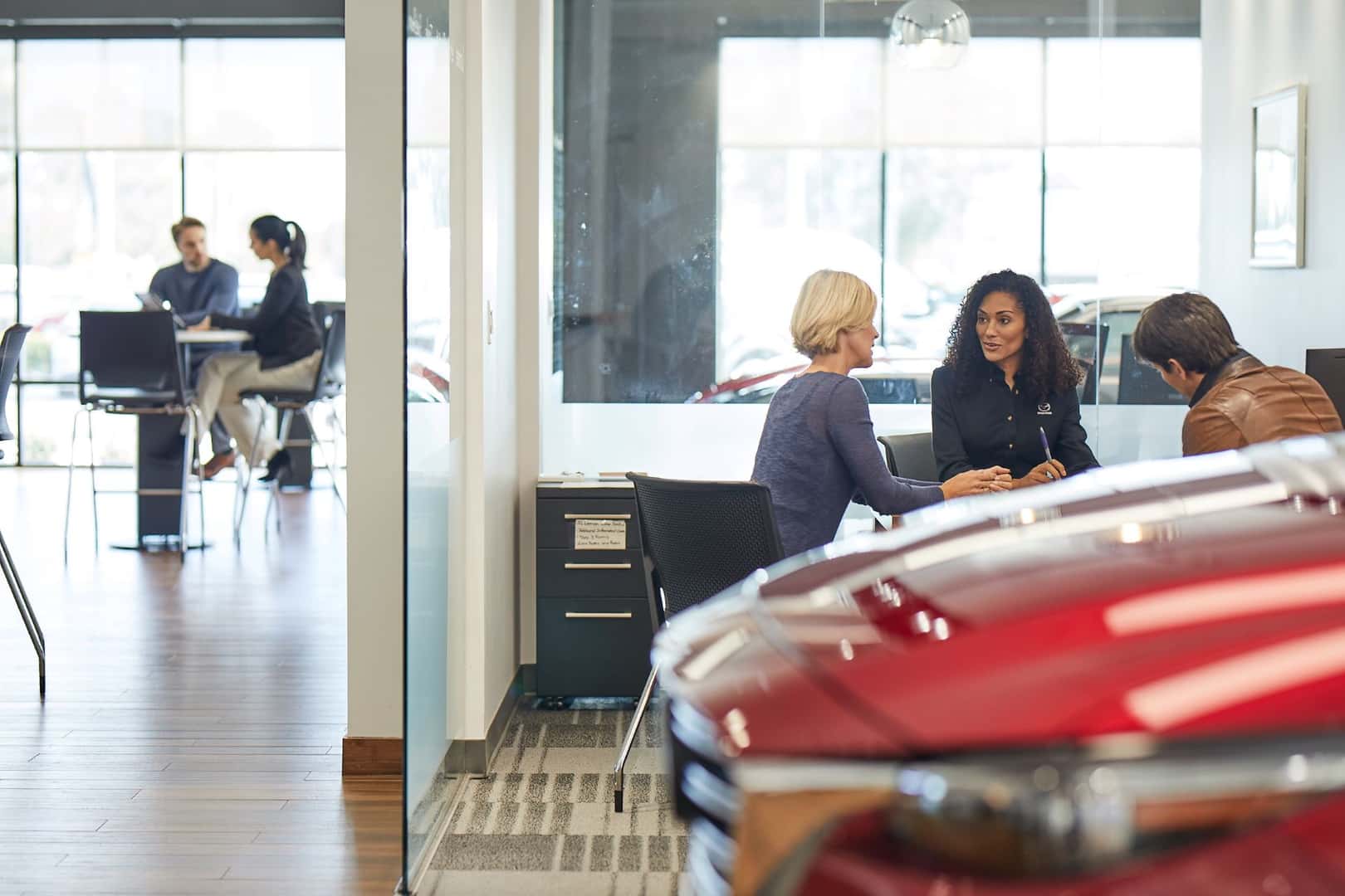 Customers speaking with dealer about Mazda extended warranty