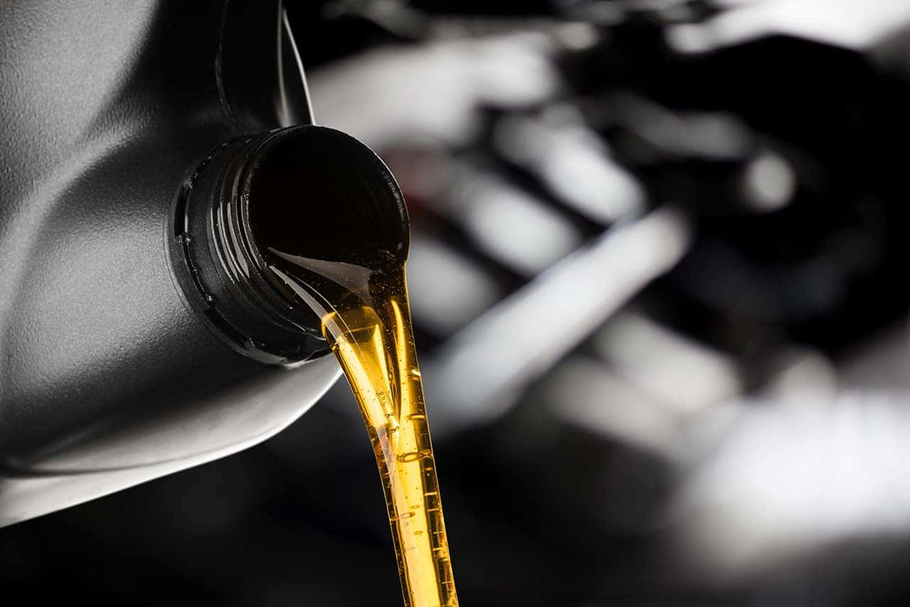Pouring oil for a Mazda oil change