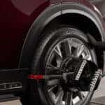 Technician working on vehicle in a Mazda tire shop
