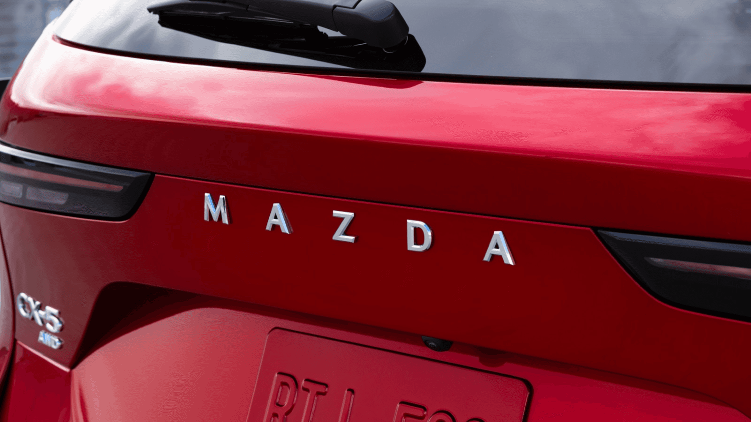 Rear badging of a new Mazda vehicle